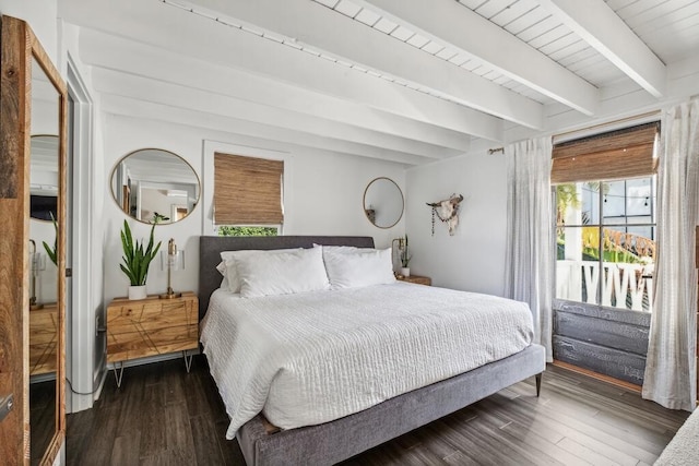 bedroom featuring access to exterior, wood finished floors, and beamed ceiling