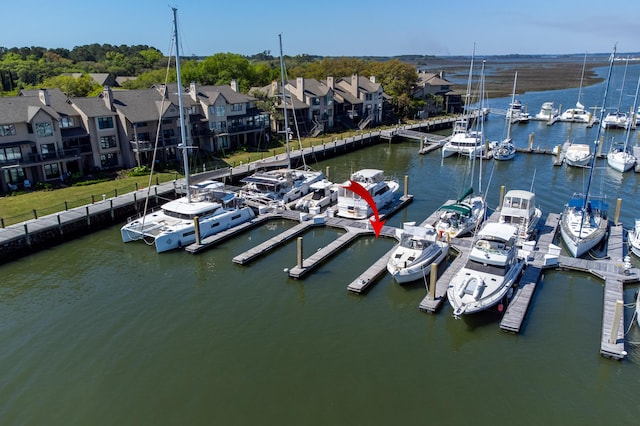 dock area featuring a residential view and a water view