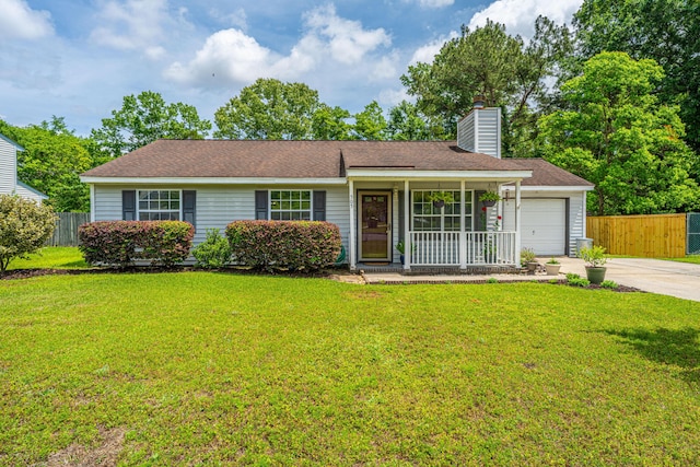 ranch-style house featuring a garage, a front lawn, fence, and driveway