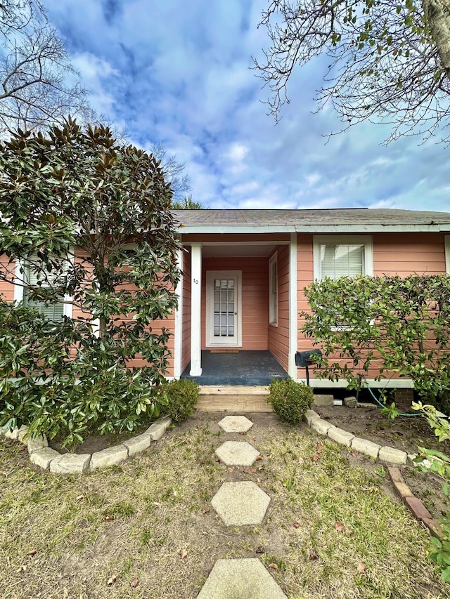 property entrance with covered porch