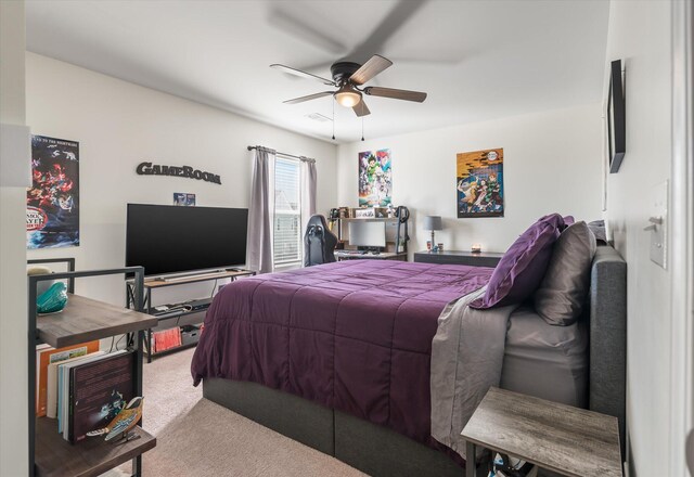 carpeted bedroom with ceiling fan