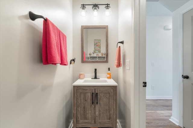 bathroom featuring wood-type flooring and vanity