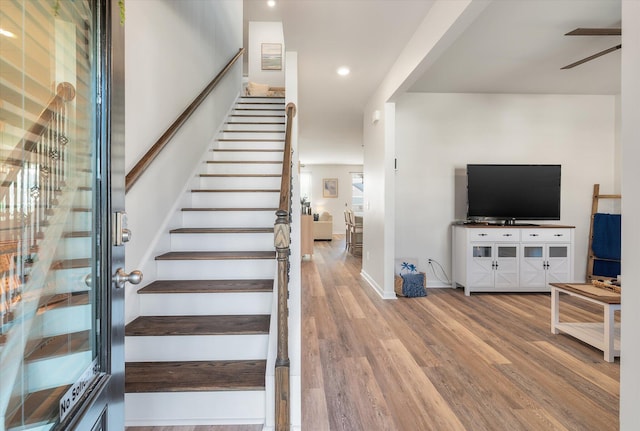 staircase with wood-type flooring