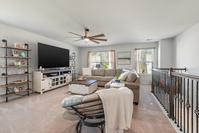 living room with light colored carpet and ceiling fan