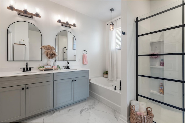 bathroom featuring independent shower and bath and vanity