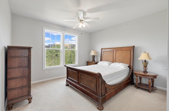 bedroom with ceiling fan and light colored carpet