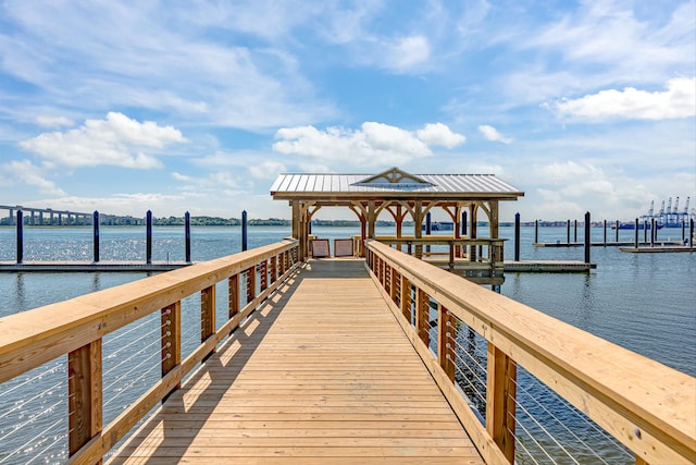 view of dock featuring a water view and a gazebo