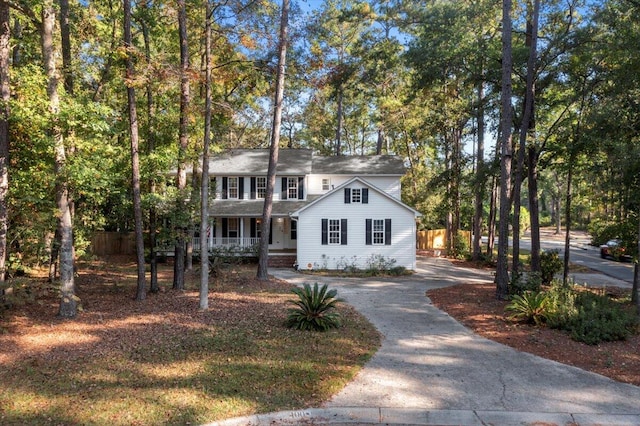 colonial home featuring covered porch