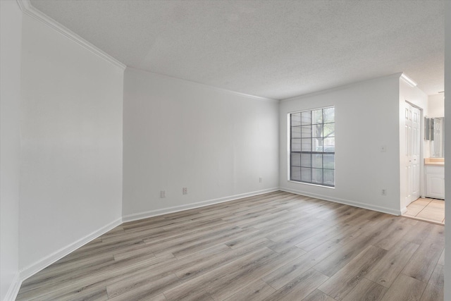 1860 Montclair Dr Unit 1860-A, Mount Pleasant, SC 29464 - empty room featuring baseboards, a textured ceiling, light wood-style floors, and ornamental molding