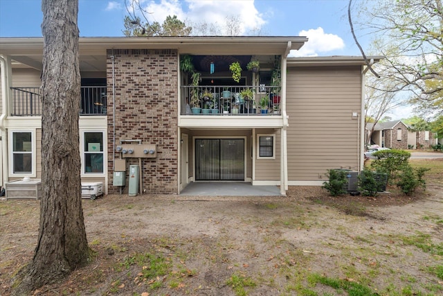 1860 Montclair Dr Unit 1860-A, Mount Pleasant, SC 29464 - rear view of property featuring a balcony, a patio, and brick siding