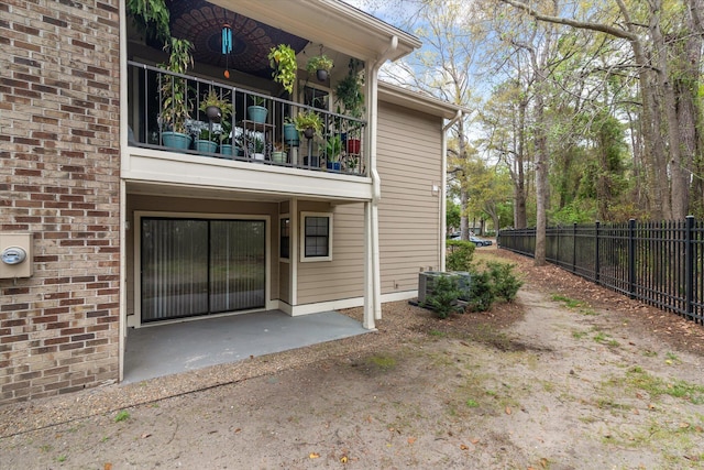 1860 Montclair Dr Unit 1860-A, Mount Pleasant, SC 29464 - exterior space with central air condition unit, fence, brick siding, a balcony, and a patio