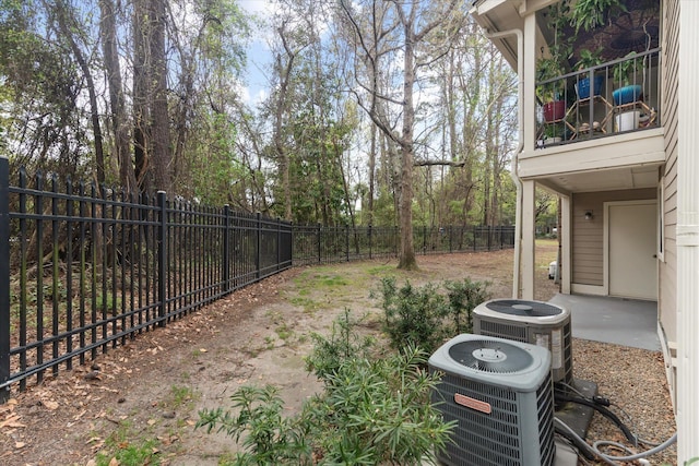 1860 Montclair Dr Unit 1860-A, Mount Pleasant, SC 29464 - view of yard featuring central AC, a fenced backyard, and a balcony