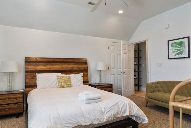 bedroom with light colored carpet, vaulted ceiling, and ceiling fan