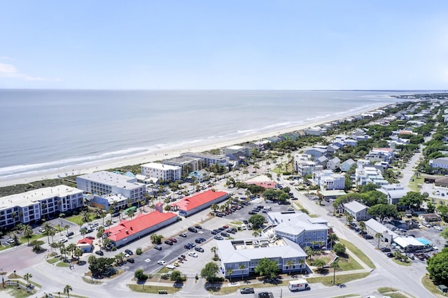 drone / aerial view with a water view and a view of the beach