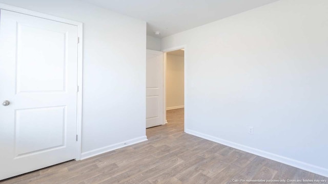 spare room featuring light hardwood / wood-style floors