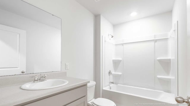 full bathroom with shower / tub combination, vanity, and toilet