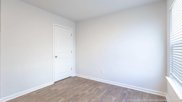 unfurnished room featuring light hardwood / wood-style floors