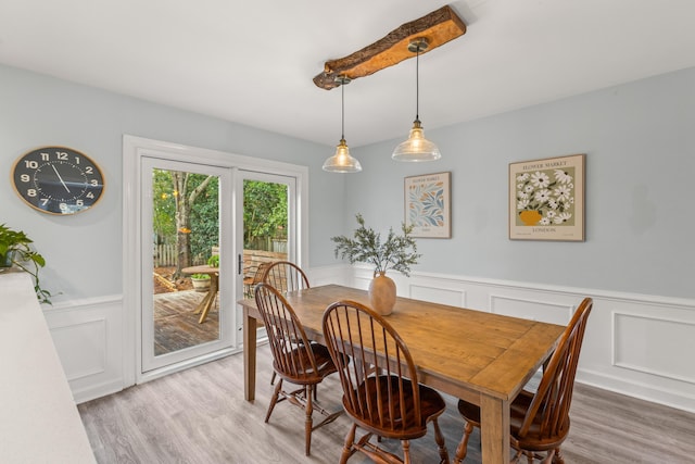 dining area with hardwood / wood-style floors