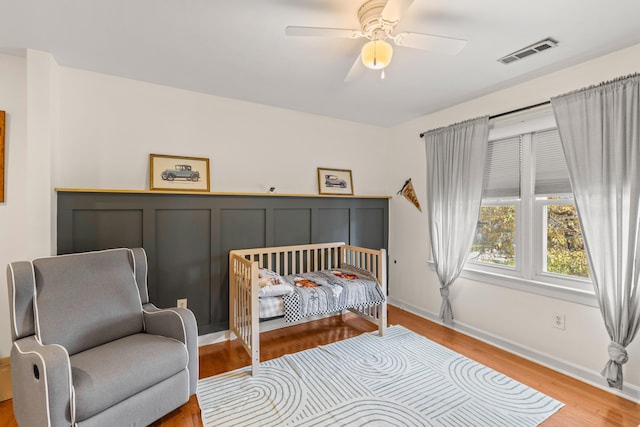 bedroom featuring ceiling fan and light hardwood / wood-style flooring