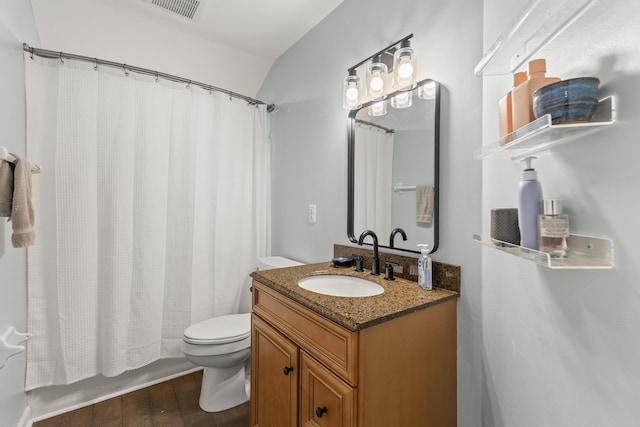 full bathroom featuring wood-type flooring, vaulted ceiling, toilet, shower / tub combo with curtain, and vanity