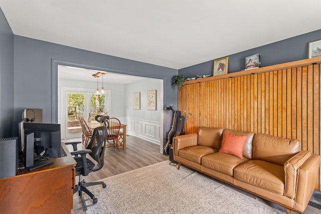 home office with hardwood / wood-style flooring and french doors