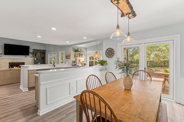 dining room featuring light wood-type flooring and sink