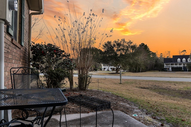 view of patio terrace at dusk