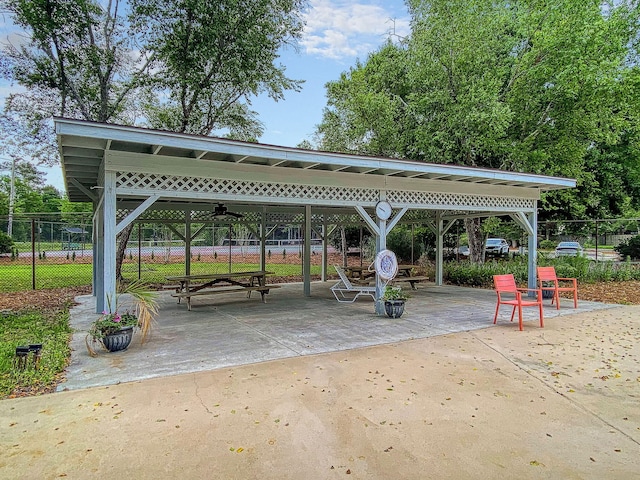 view of community with a patio area, fence, and a gazebo