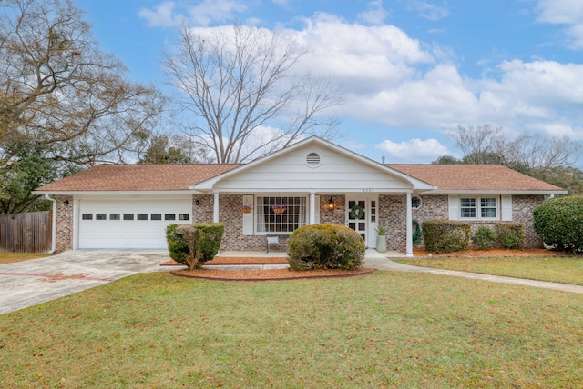 ranch-style house featuring a front yard and a garage