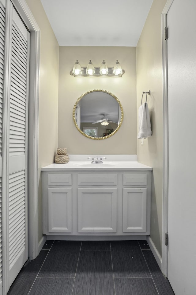 bathroom featuring ceiling fan, vanity, and tile patterned flooring