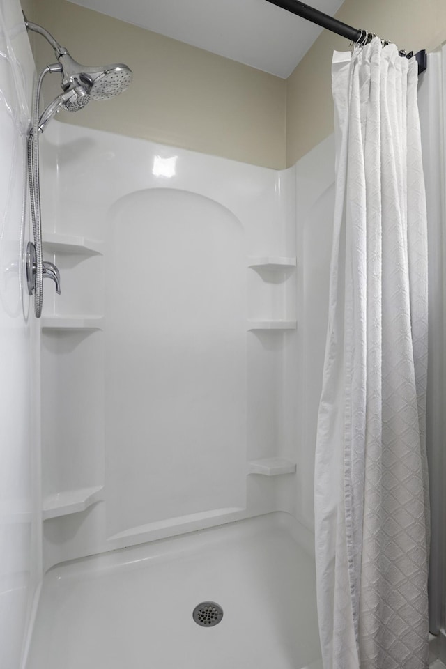 bathroom with a shower with shower curtain