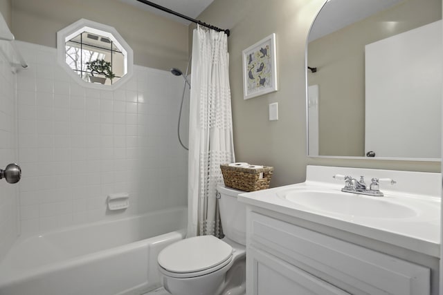 full bathroom featuring toilet, vanity, and shower / tub combo with curtain