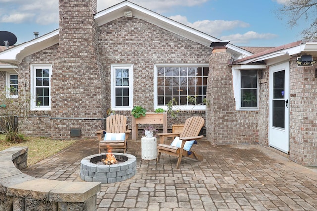 view of patio / terrace with a fire pit