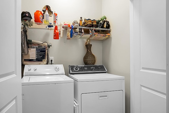 washroom with washing machine and dryer