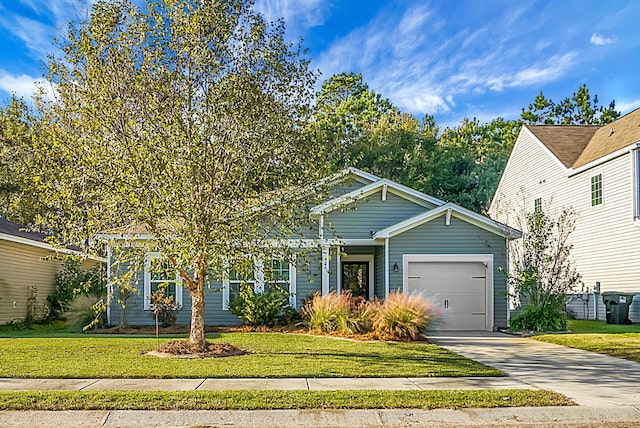 view of front of home featuring a garage and a front yard