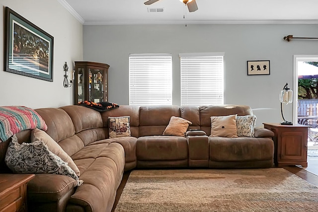 living room with ceiling fan, wood-type flooring, and crown molding