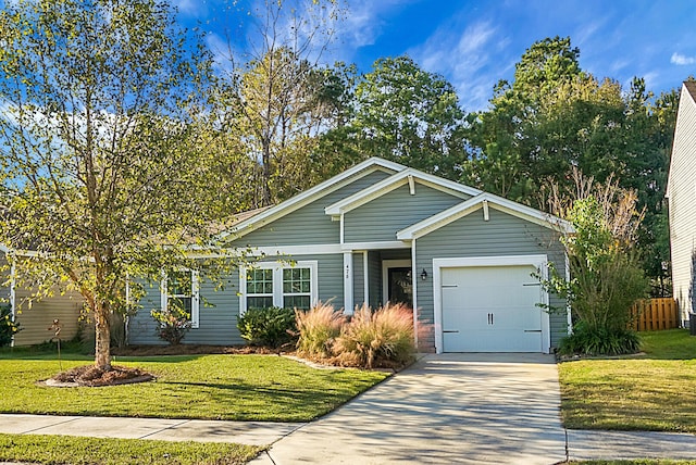 view of front of house with a garage and a front lawn