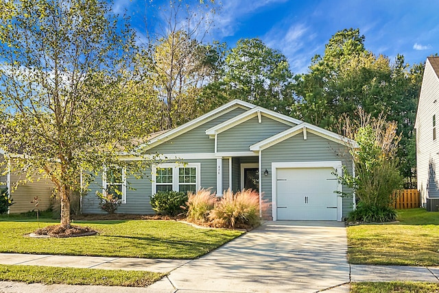 view of front facade featuring a front yard and a garage