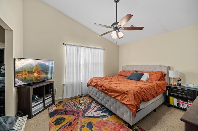 carpeted bedroom with ceiling fan and lofted ceiling