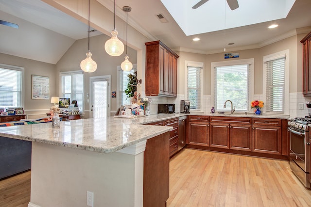 kitchen with visible vents, ceiling fan, a sink, light wood-style flooring, and appliances with stainless steel finishes
