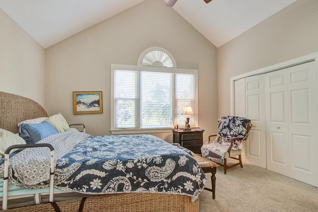 carpeted bedroom featuring a closet, high vaulted ceiling, multiple windows, and ceiling fan