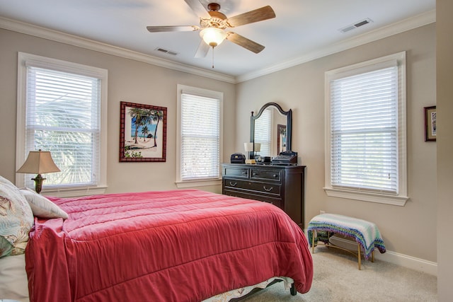 bedroom with carpet flooring, crown molding, visible vents, and baseboards