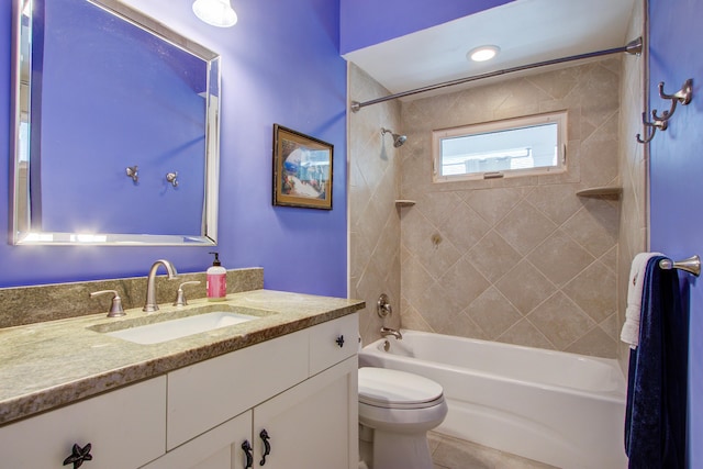 bathroom featuring shower / bathtub combination, toilet, tile patterned floors, and vanity