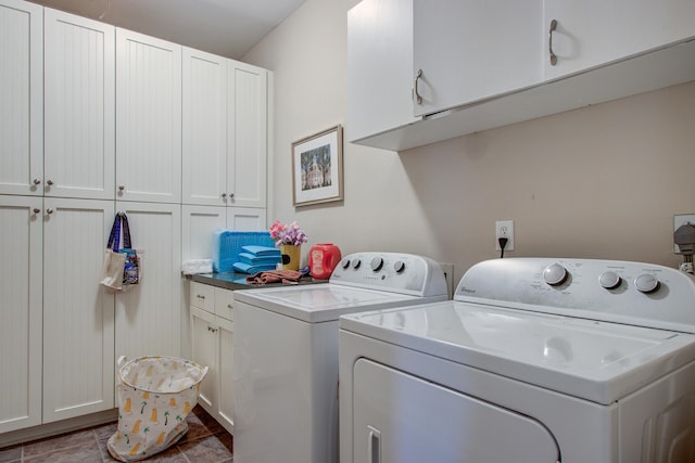 washroom featuring cabinet space and washing machine and clothes dryer