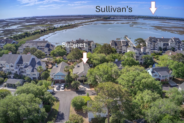 drone / aerial view with a water view and a residential view
