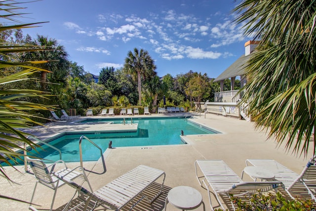 community pool with a patio