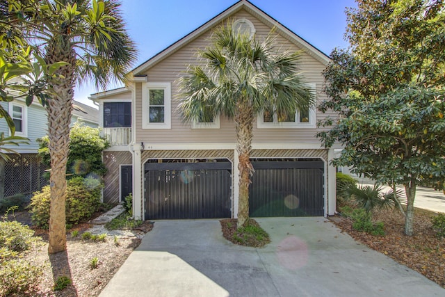 view of front of house featuring an attached garage and concrete driveway
