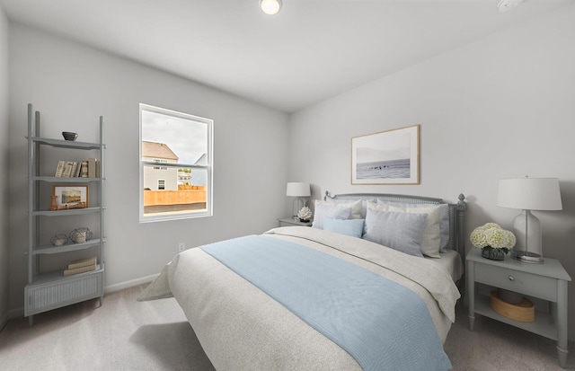 bedroom featuring baseboards and carpet