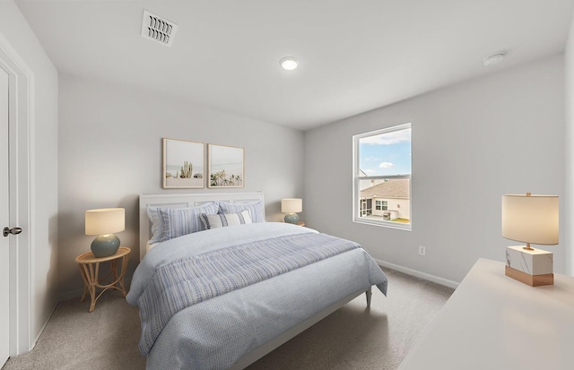 bedroom with visible vents, carpet floors, and baseboards