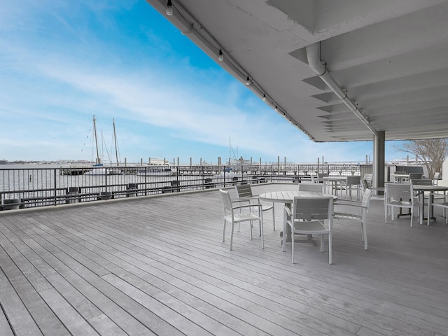 wooden deck featuring a water view